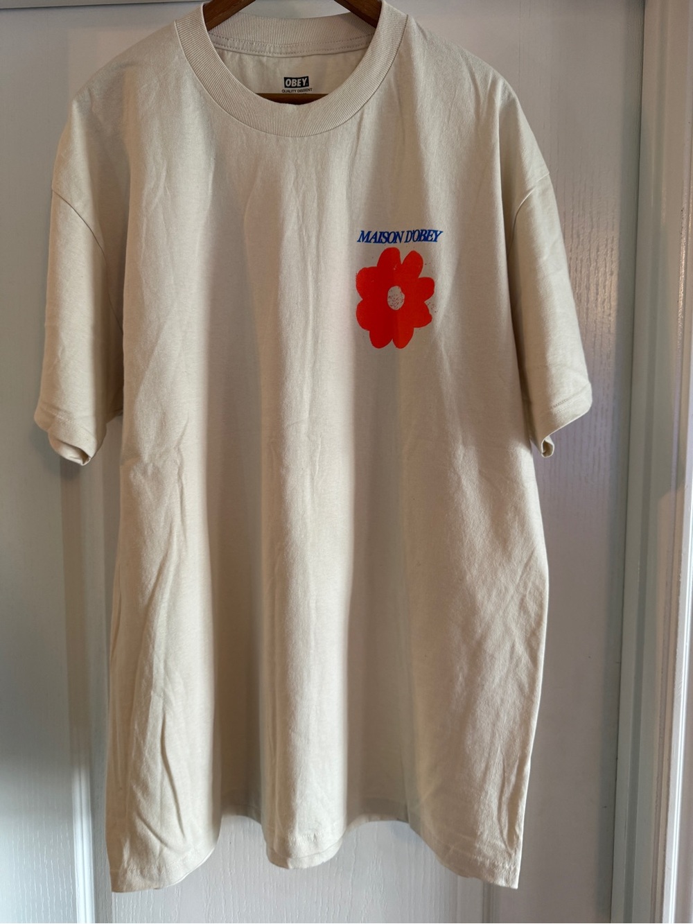 Obey Cream Graphic Tee with orange  Flower size XL